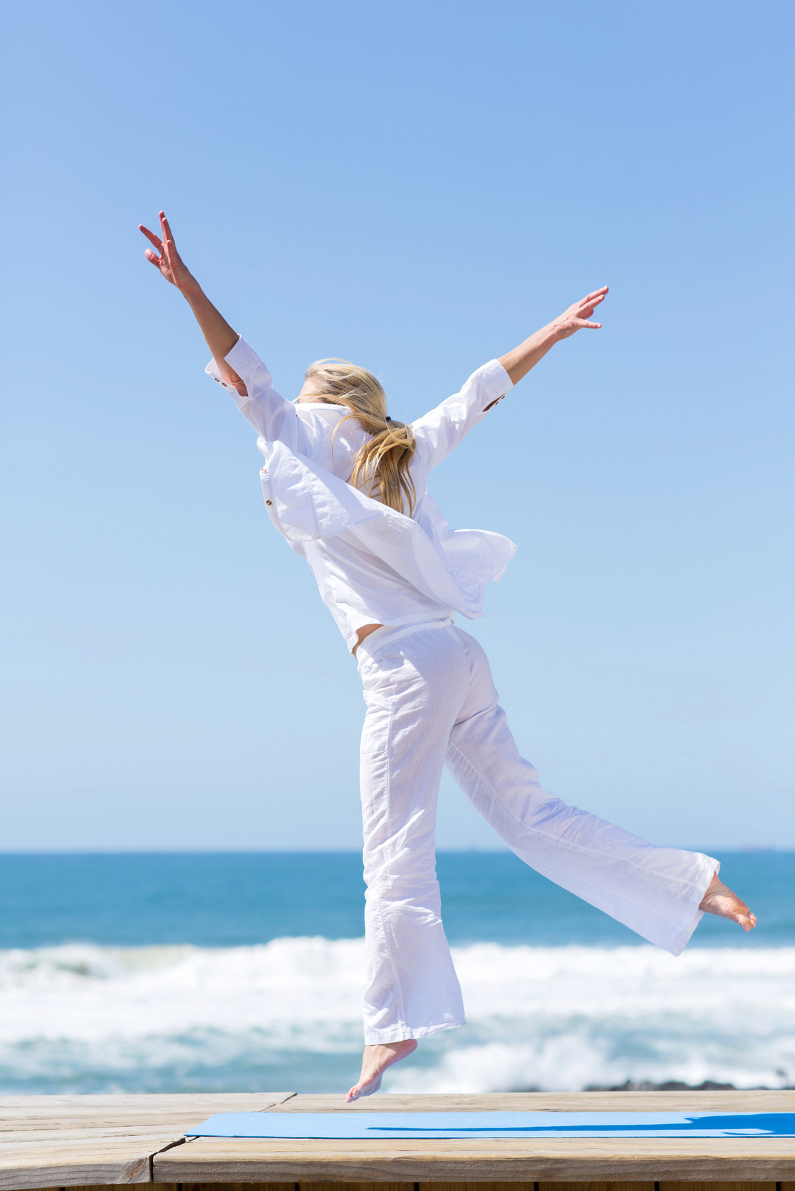 active middle aged woman jumping